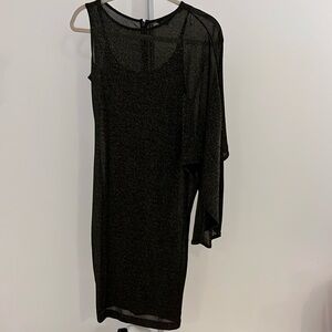 Asymmetrical, one sleeve dress.